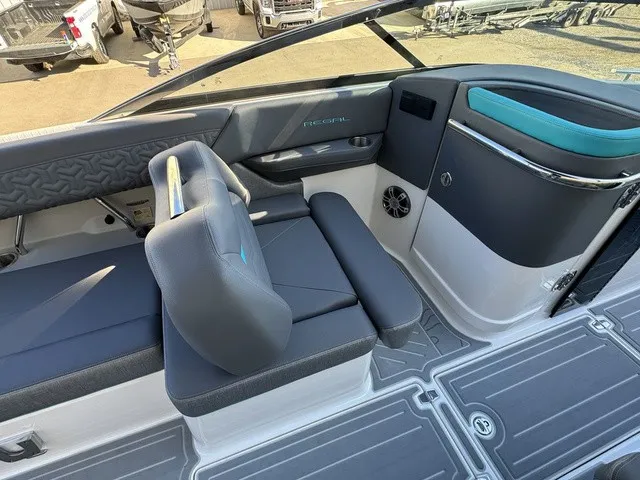 Slide: The Image of Interior of a 2024 Regal LS6 with gray and blue seating, speaker, and modern design. - 19