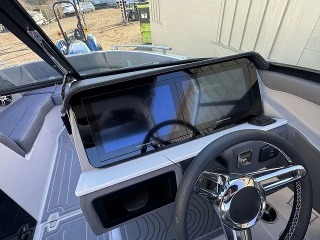 Slide: The Image of The dashboard of a 2024 Regal LS6 with a large screen and modern steering wheel. - 22