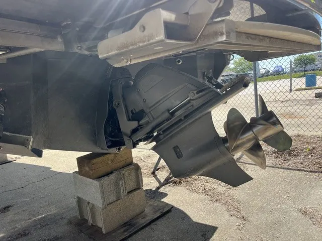 Slide: The Image of Close-up of a boat propeller on a 2024 Regal LS6, supported by concrete blocks. - 25