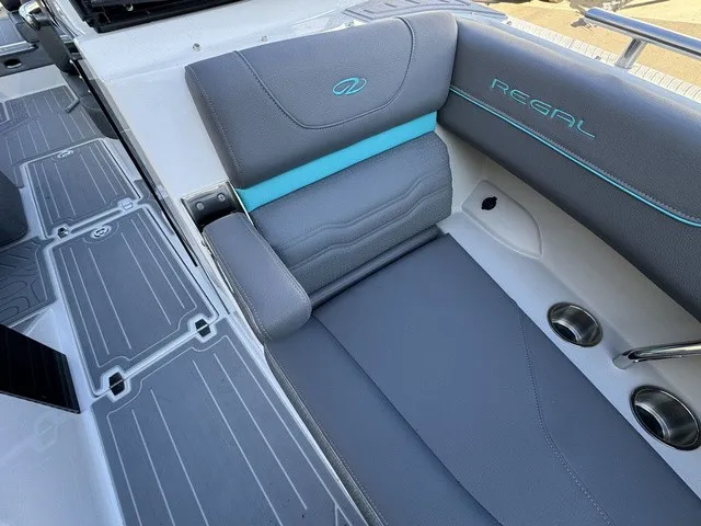 Slide: The Image of The image shows the stylish cockpit of a 2024 Regal LS6 boat with gray and blue accents. - 7