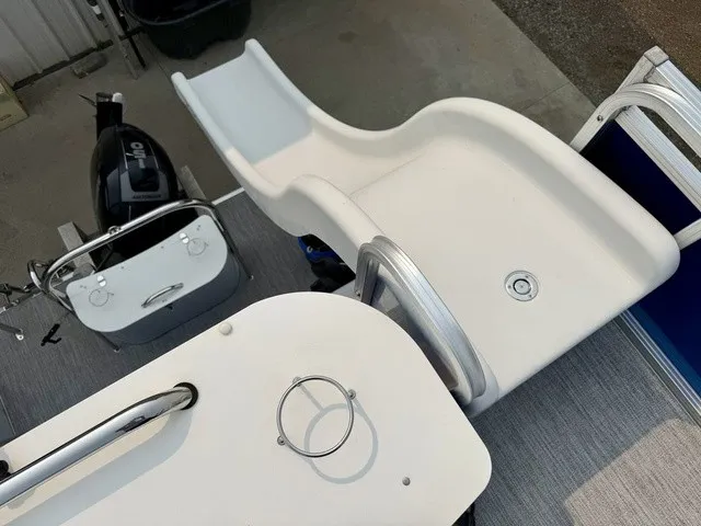 Slide: The Image of A boat with a white slide and an outboard motor. It features a modern design. - 21