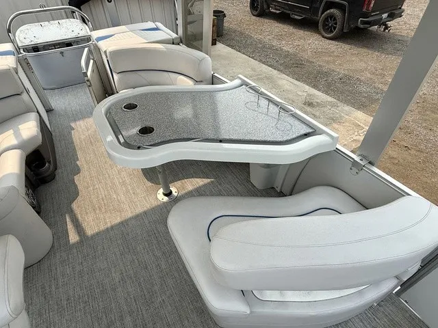 Slide: The Image of The image shows the interior of a 2016 Tahoe 2785 Vista Fun Ship with elegant seating and a table. - 14