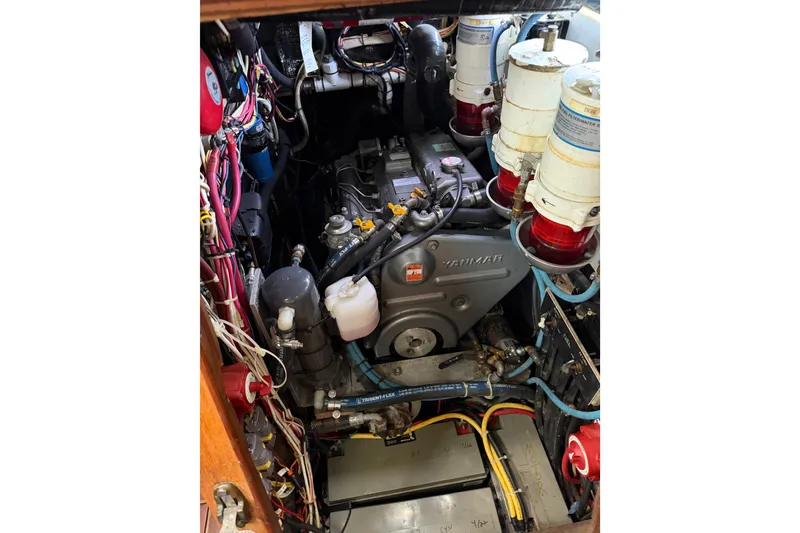 Slide: The Image of Engine compartment of a 1985 Shannon Ketch sailboat with Yanmar engine and wiring. - 10