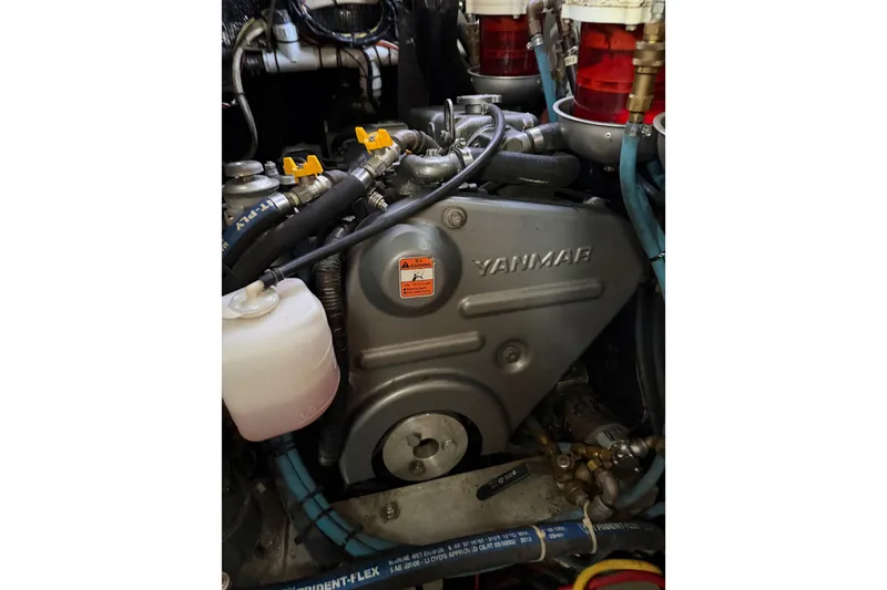 Slide: The Image of Engine compartment of a 1985 Shannon Ketch sailboat featuring a Yanmar engine. - 11