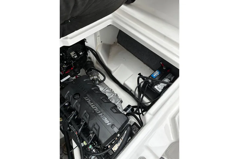 Slide: The Image of 2023 Yamaha AR250 engine compartment showcasing high-output engine and battery. - 17