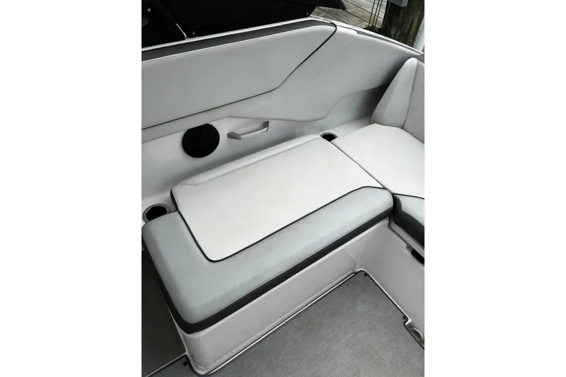 Slide: The Image of 2023 Yamaha Boats AR250 interior seating with sleek, modern design and comfortable upholstery. - 20