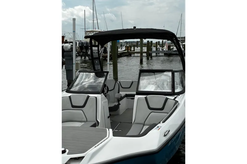 Slide: The Image of 2023 Yamaha Boats AR250 at marina, featuring sleek design and comfortable seating. - 31
