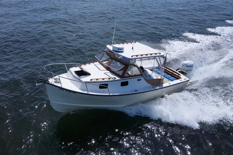 Slide: The Image of 2019 Seaway Seafarer 24 cruising on open water, showcasing sleek design and powerful performance. - 4