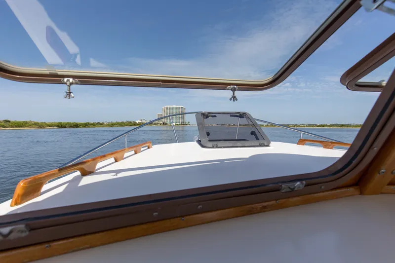 Slide: The Image of 2019 Seaway Seafarer 24 boat view through cabin window on calm water. - 20