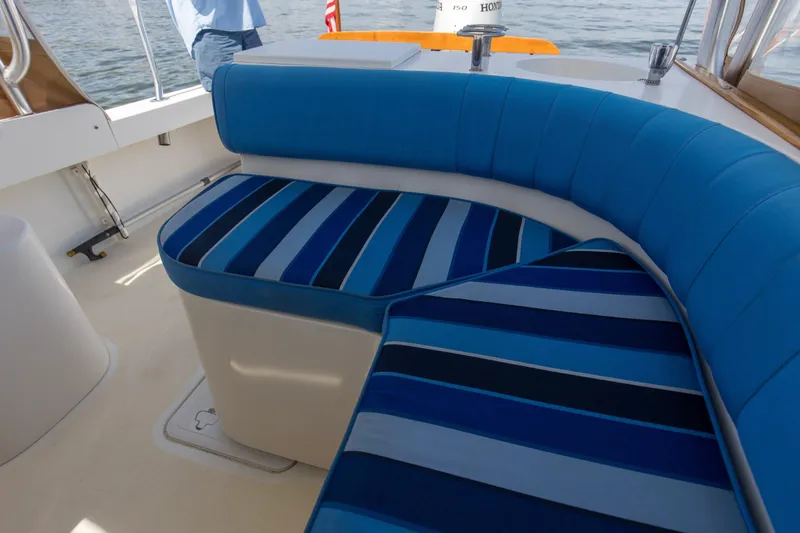 Slide: The Image of Blue-striped seating on 2019 Seaway Seafarer 24 boat deck. - 27