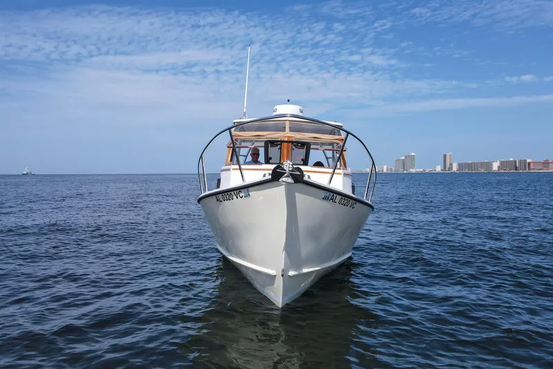 Slide: The Image of 2019 Seaway Seafarer 24 boat on open water with city skyline in background. - 30