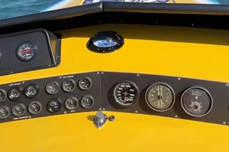 Slide: The Image of Dashboard of a 1987 Apache 47 boat with multiple gauges and instruments. - 8