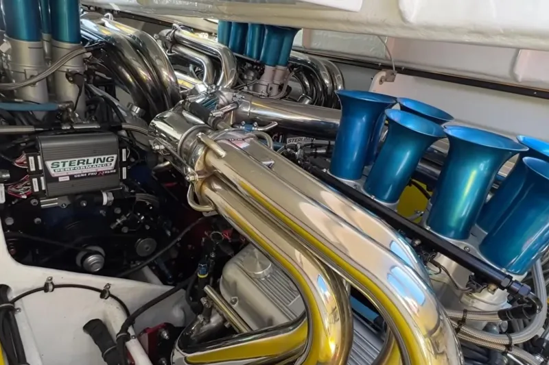 Slide: The Image of Engine compartment of a 1987 Apache 47 boat with Sterling performance parts. - 12