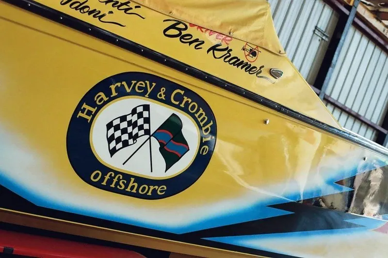 Slide: The Image of Yellow Apache 47 boat from 1987 with "Harvey & Crombie Offshore" logo. - 20