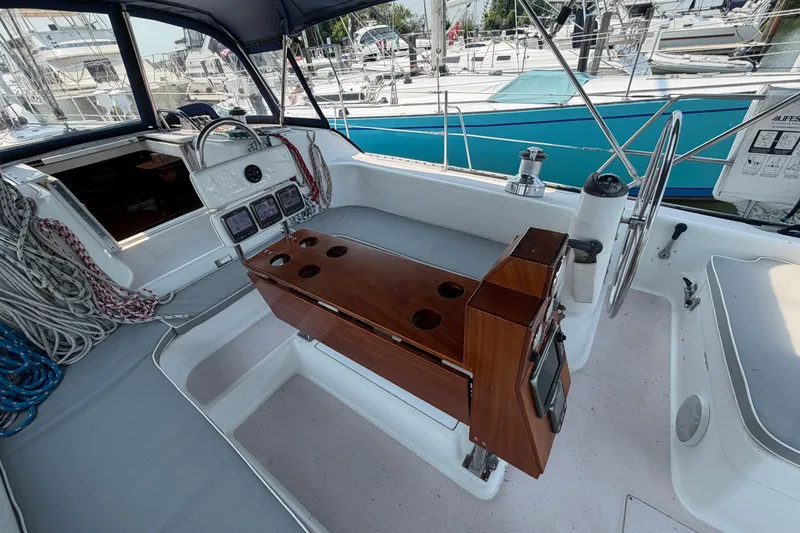Slide: The Image of Cockpit of a 1995 Catalina 400 sailboat with steering wheel and navigation instruments. - 10