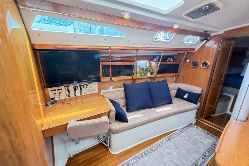Slide: The Image of Interior of a 1995 Catalina 400 sailboat with cozy seating and modern amenities. - 26