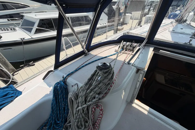 Slide: The Image of Cockpit view of a 1995 Catalina 400 sailboat with ropes and winch. - 13