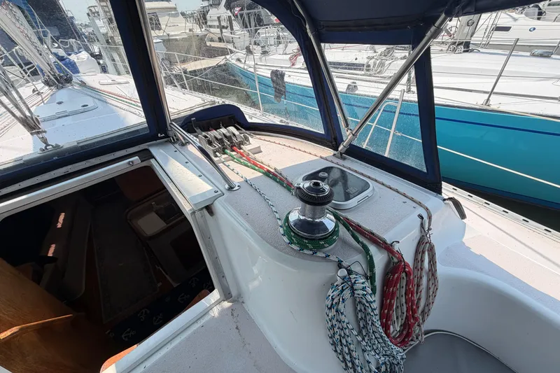 Slide: The Image of Cockpit view of a 1995 Catalina 400 sailboat with ropes and winch. - 14