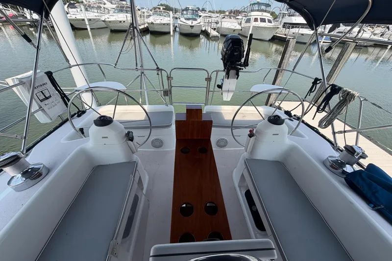 Slide: The Image of Cockpit view of a 1995 Catalina 400 sailboat docked at a marina. - 12