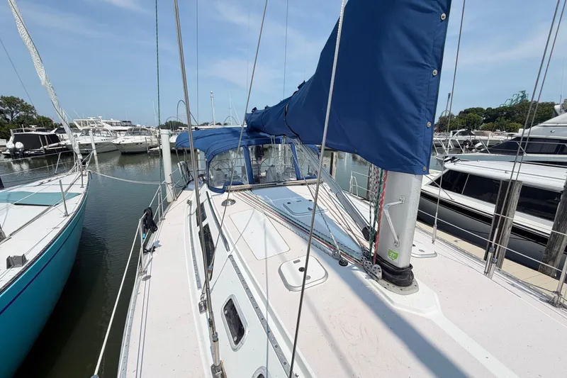 Slide: The Image of Sailboat Catalina 400, 1995 model, docked in marina with blue sail cover. - 18