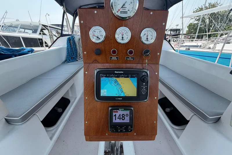 Slide: The Image of Cockpit of 1995 Catalina 400 sailboat with navigation instruments and seating. - 7