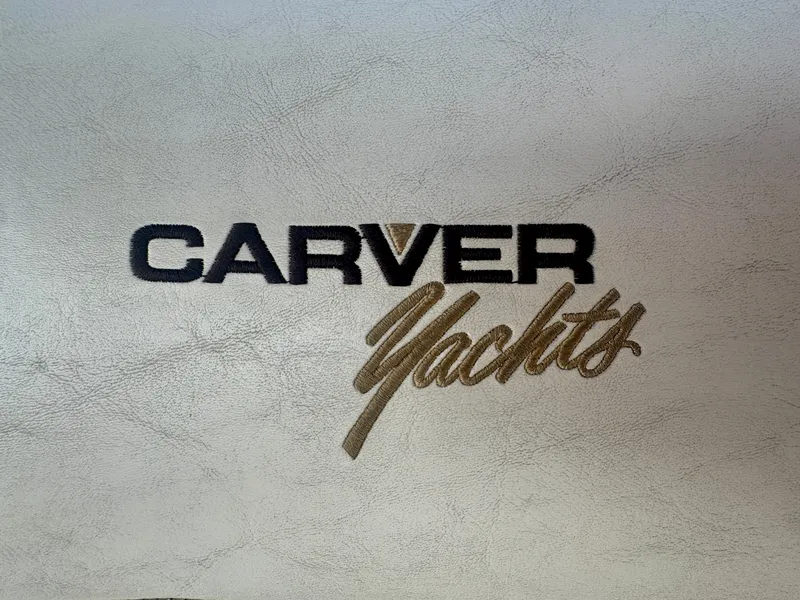 Slide: The Image of Carver Yachts logo on a textured surface, possibly part of a boat's interior. - 29