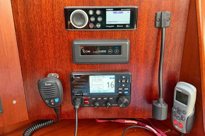 Slide: The Image of Control panel of a 2006 Beneteau 423 yacht with Icom and Fusion equipment. - 30