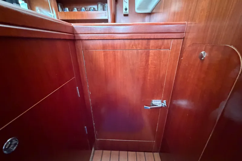 Slide: The Image of Wooden interior cabinetry on a 2006 Beneteau 423 sailboat. - 35