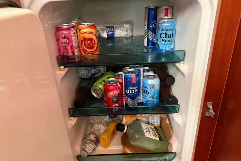 Slide: The Image of Mini fridge stocked with assorted drinks on a 2006 Beneteau 423 yacht. - 37
