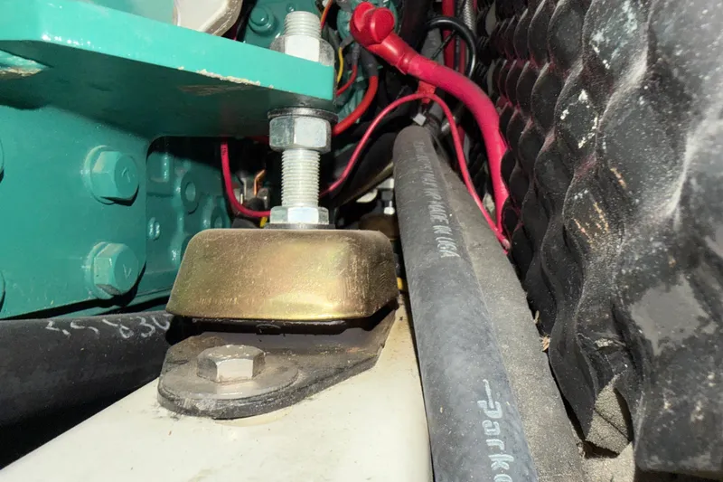 Slide: The Image of Engine compartment of a 2006 Beneteau 423 sailboat, showing mechanical components and wiring. - 58