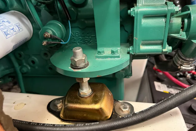 Slide: The Image of Engine mount detail of a 2006 Beneteau 423 sailboat, showcasing mechanical components. - 57