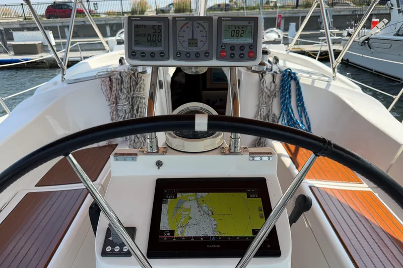 Slide: The Image of Cockpit view of a 2006 Beneteau 423 sailboat with navigation instruments. - 10
