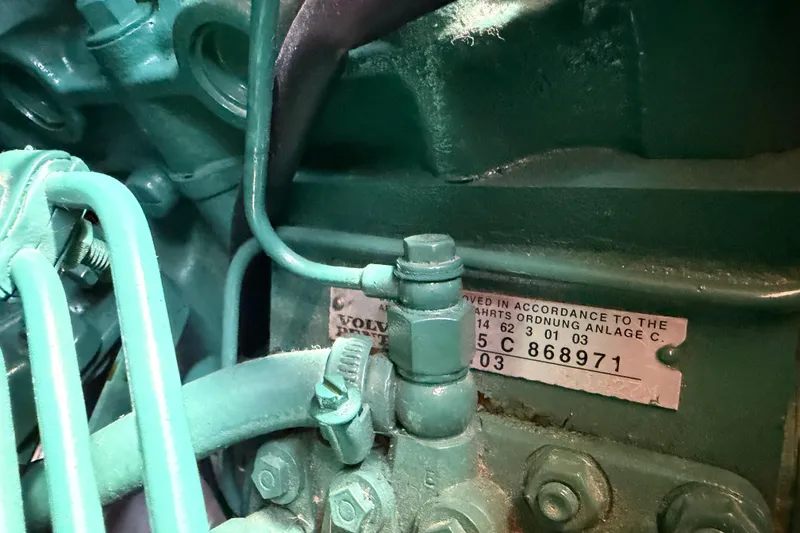 Slide: The Image of Close-up of a Volvo Penta engine component in a 2006 Beneteau 423 sailboat. - 55