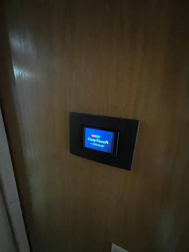 Slide: The Image of EasyTouch control panel on 1995 Hatteras 52 Motor Yacht interior wall. - 43