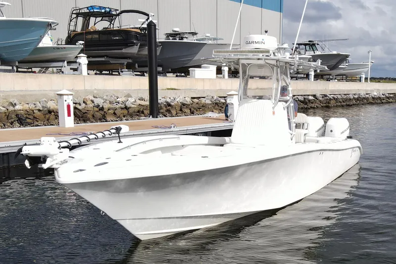 Slide: The Image of 2009 Yellowfin 29 Offshore boat docked at marina, featuring sleek design and modern equipment. - 7