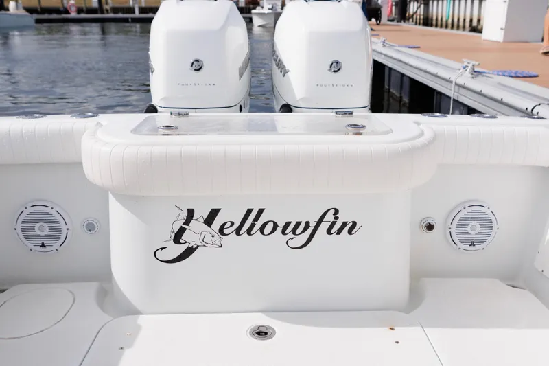 Slide: The Image of 2009 Yellowfin 29 Offshore boat with twin Mercury engines at a dock. - 15