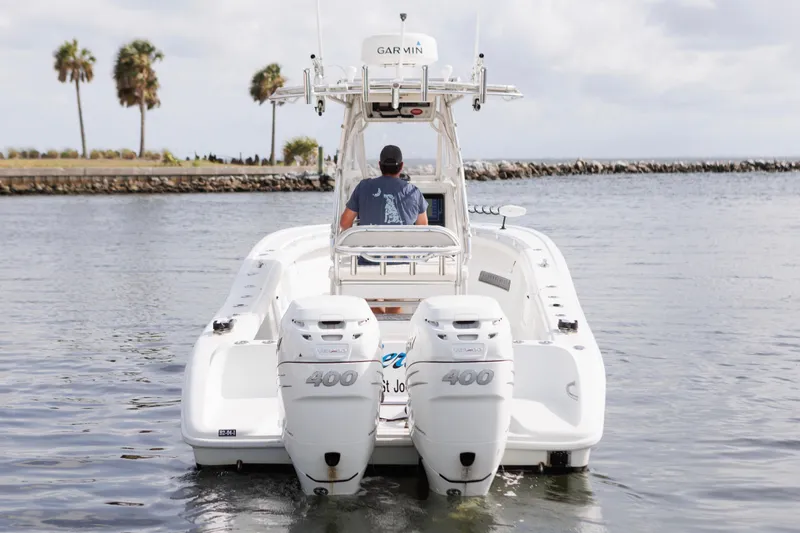 Slide: The Image of 2009 Yellowfin 29 Offshore boat with dual 400 engines on calm water. - 5