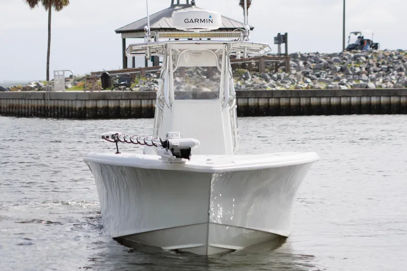 Slide: The Image of 2009 Yellowfin 29 Offshore boat on water, equipped with Garmin technology. - 4