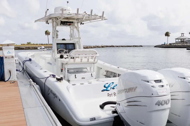 Slide: The Image of 2009 Yellowfin 29 Offshore boat docked with twin Mercury 400 engines. - 8