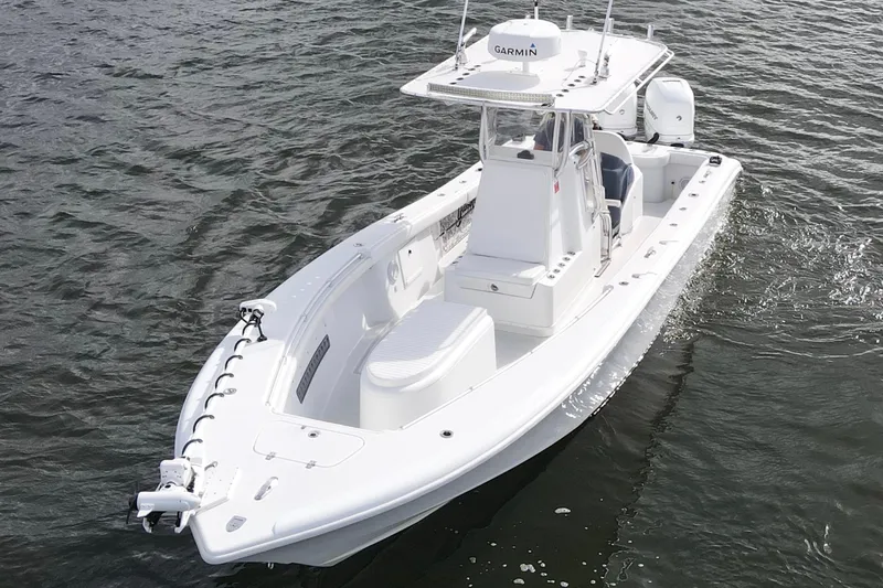 Slide: The Image of 2009 Yellowfin 29 Offshore boat cruising on water, featuring sleek design and advanced equipment. - 9