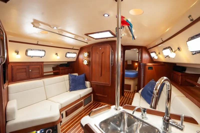 Slide: The Image of Luxurious interior of 2004 Island Packet 370 yacht with elegant wood finish and plush seating. - 4