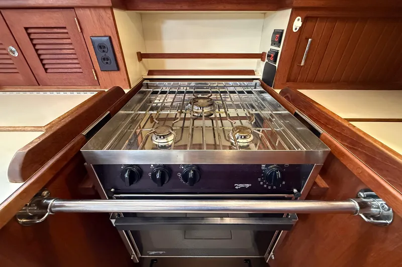 Slide: The Image of Island Packet 370 yacht kitchen with stainless steel stove, 2004 model. - 11