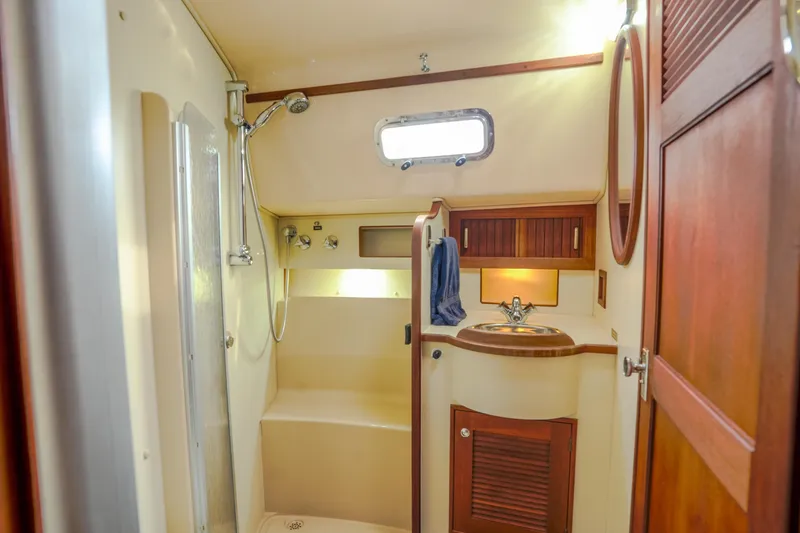 Slide: The Image of Luxurious bathroom interior of 2004 Island Packet 370 yacht with shower and sink. - 17