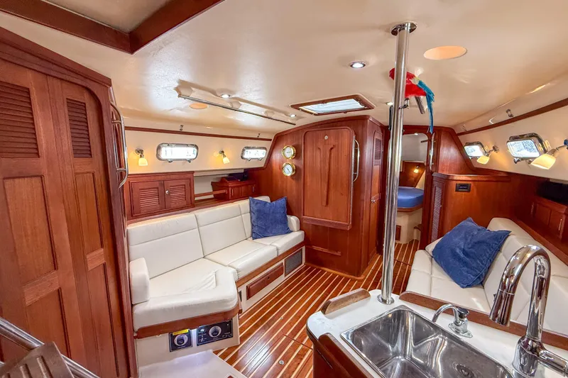 Slide: The Image of Luxurious 2004 Island Packet 370 yacht interior with elegant wood finish and cozy seating. - 3