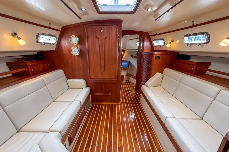 Slide: The Image of Luxurious interior of 2004 Island Packet 370 yacht with elegant wood finish and plush seating. - 6