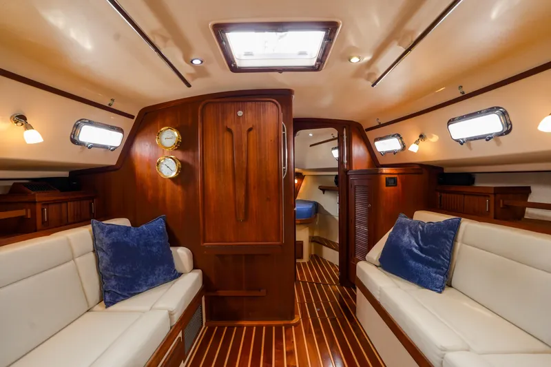 Slide: The Image of Luxurious interior of 2004 Island Packet 370 yacht with wooden finishes and plush seating. - 5