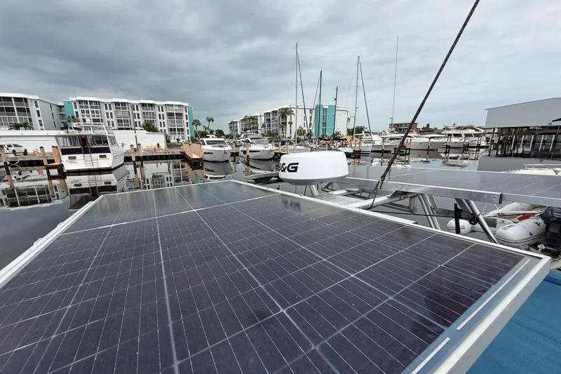 Slide: The Image of Solar panels on a 2004 Island Packet 370 yacht docked at a marina. - 29
