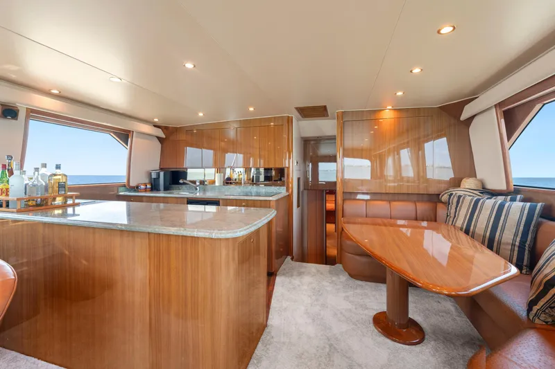 Slide: The Image of Luxurious interior of 2006 Viking 68 Convertible yacht with elegant wood finishes and modern amenities. - 25