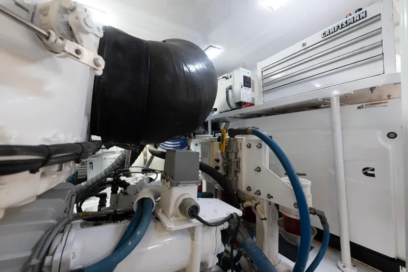 Slide: The Image of Engine room of 2006 Viking 68 Convertible yacht with Craftsman toolbox and Cummins equipment. - 52