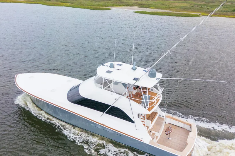 Slide: The Image of 2006 Viking 68 Convertible yacht cruising on open water. - 1